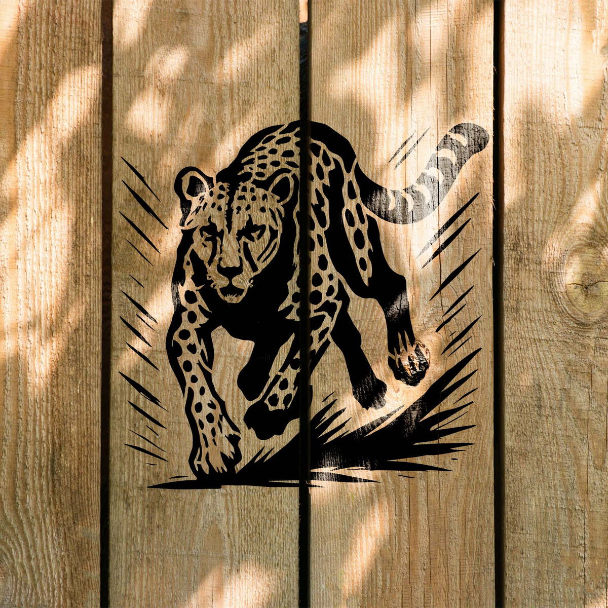 Running Cheetah Wildlife Stencil painted in black on natural wood fence