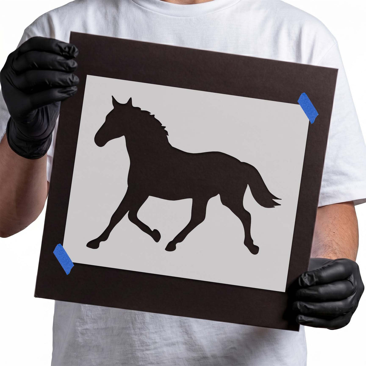 Bold Running Horse Silhouette Stencil shown on a stencil sheet with a sleek horse in motion design