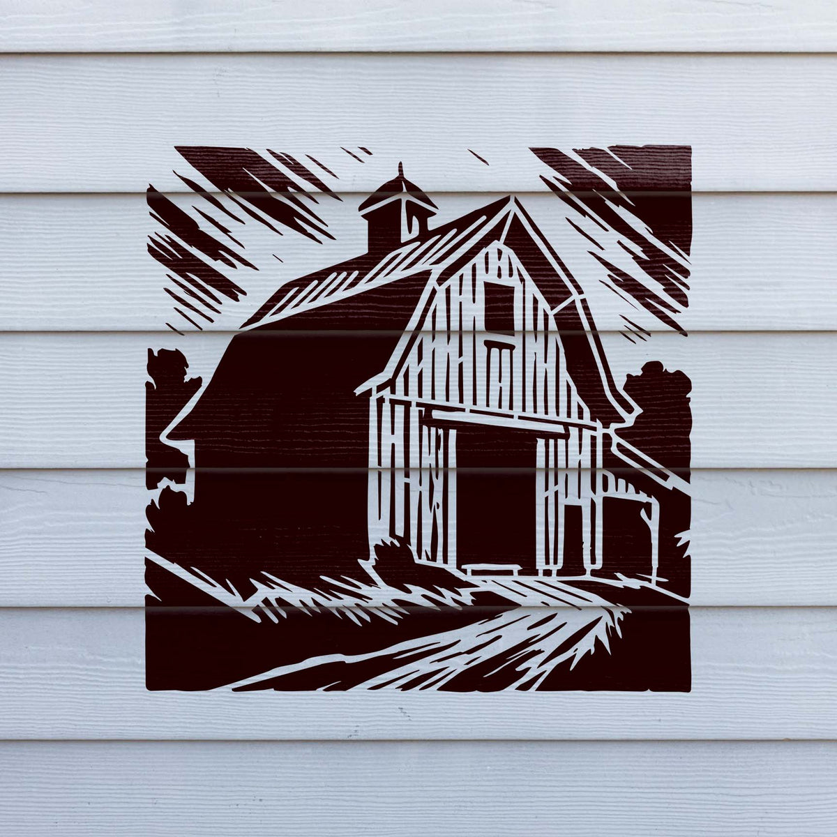 Rustic Gambrel Barn Stencil painted in burgundy across white horizontal siding.