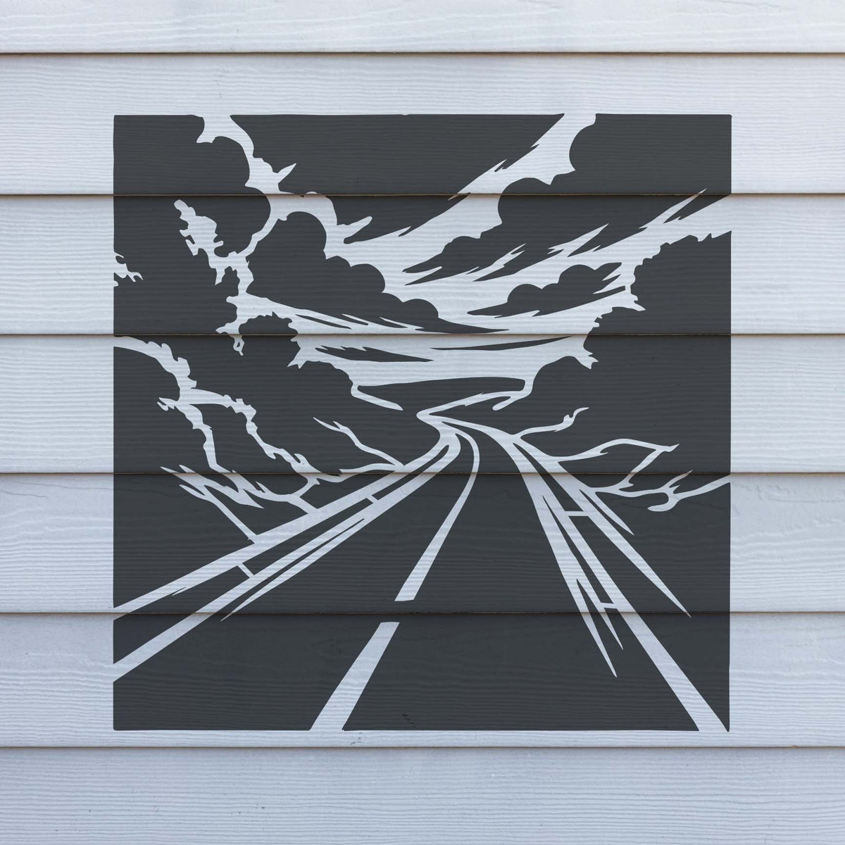 Bold Scenic Winding Highway Landscape Stencil displays a winding road across white wood siding