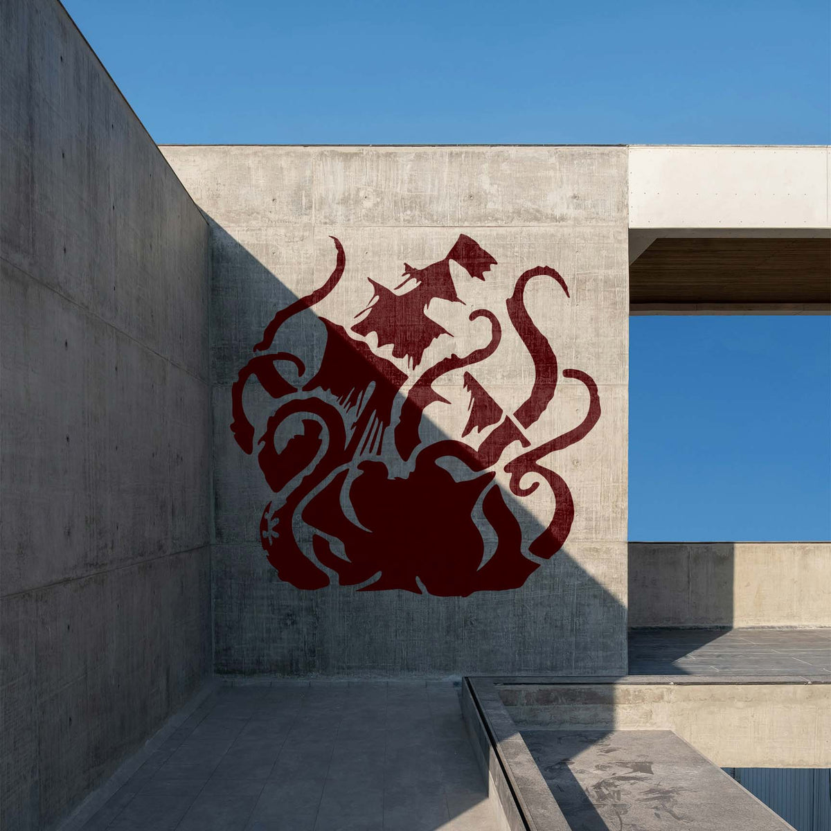 Dramatic Sea Monster Attack Stencil displayed in deep red on a modern concrete wall
