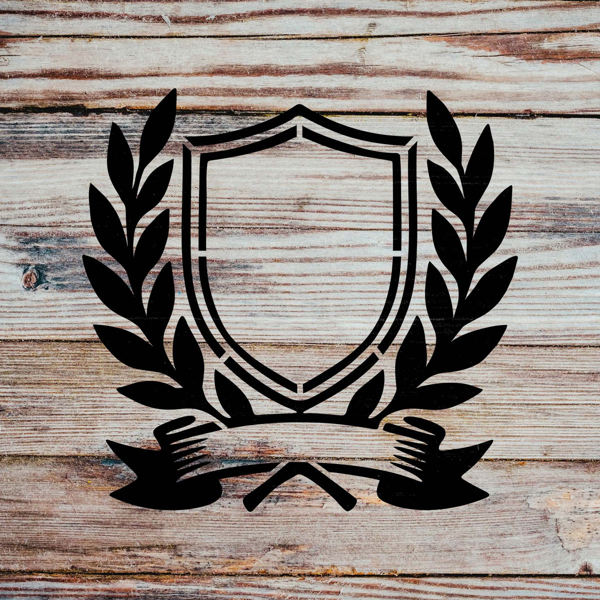 Service Crest Stencil forms a classic shield and laurel insignia across rustic wood