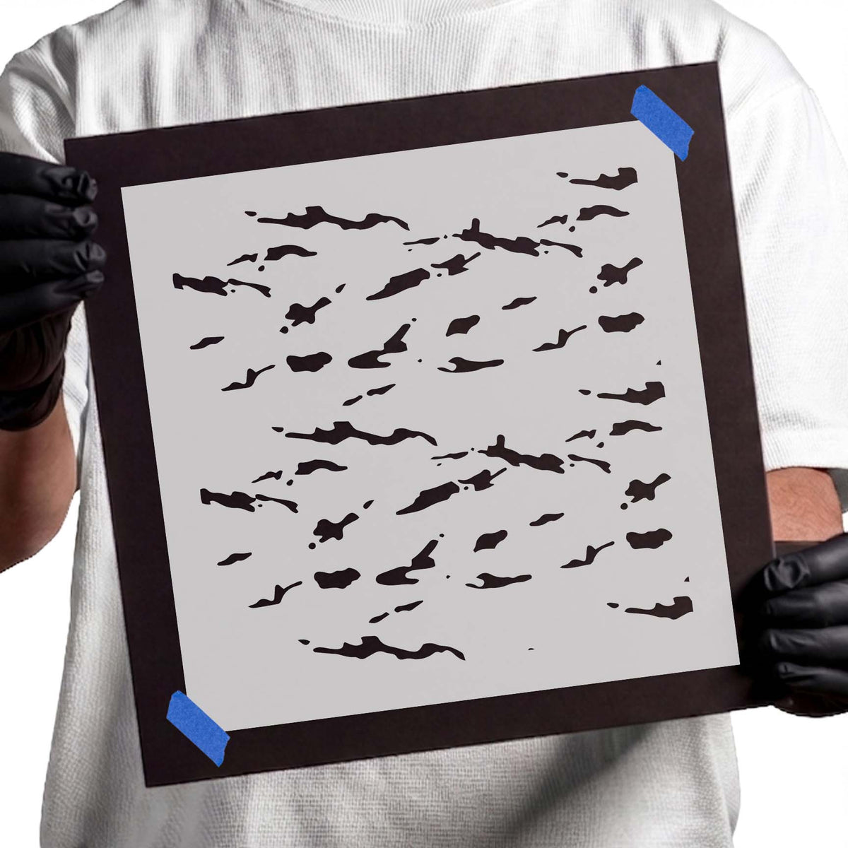 Simple Camouflage Pattern Stencil featuring scattered streaks, irregular patches, and small speckles
