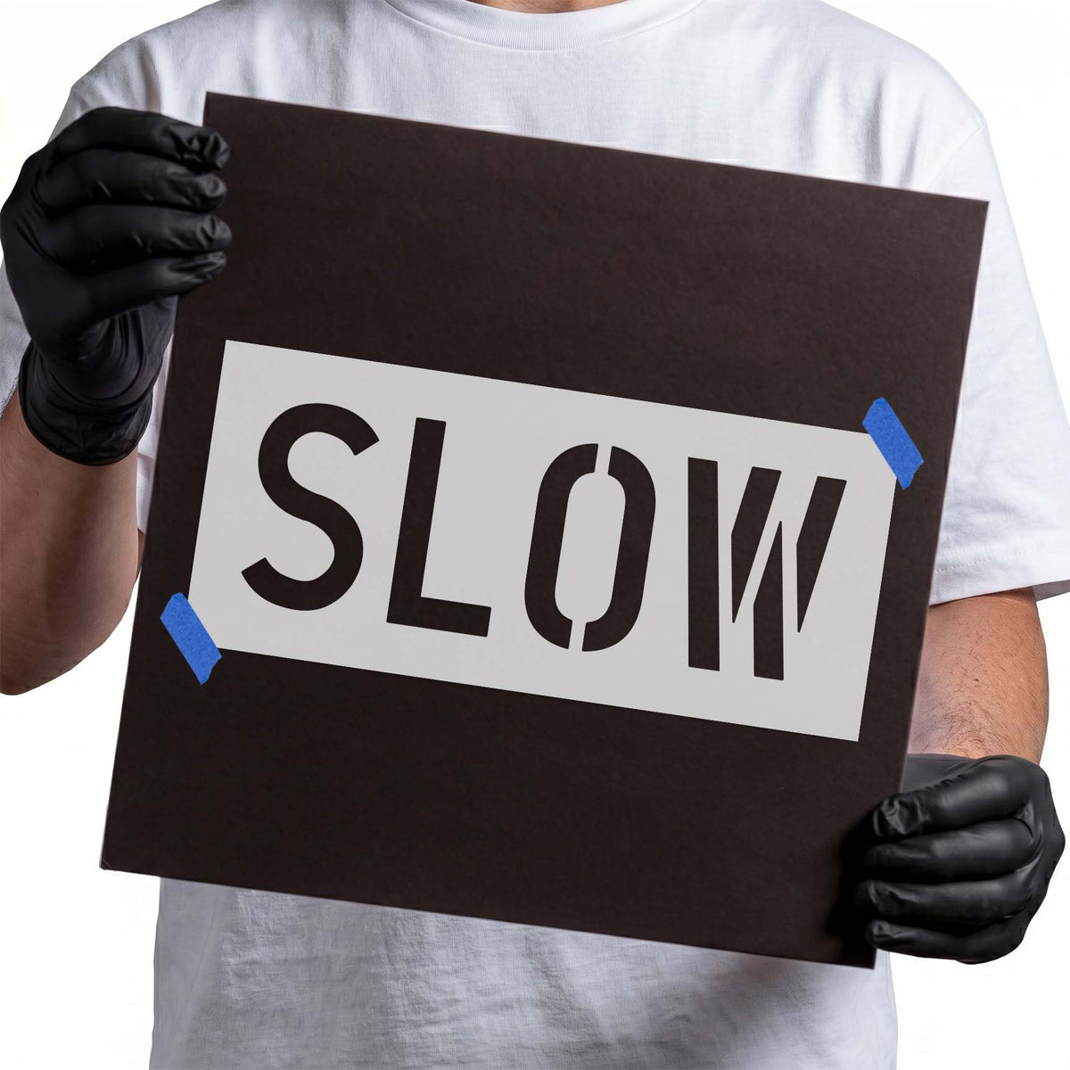 Slow Sign Stencil with bold uppercase lettering displayed on a reusable stencil sheet
