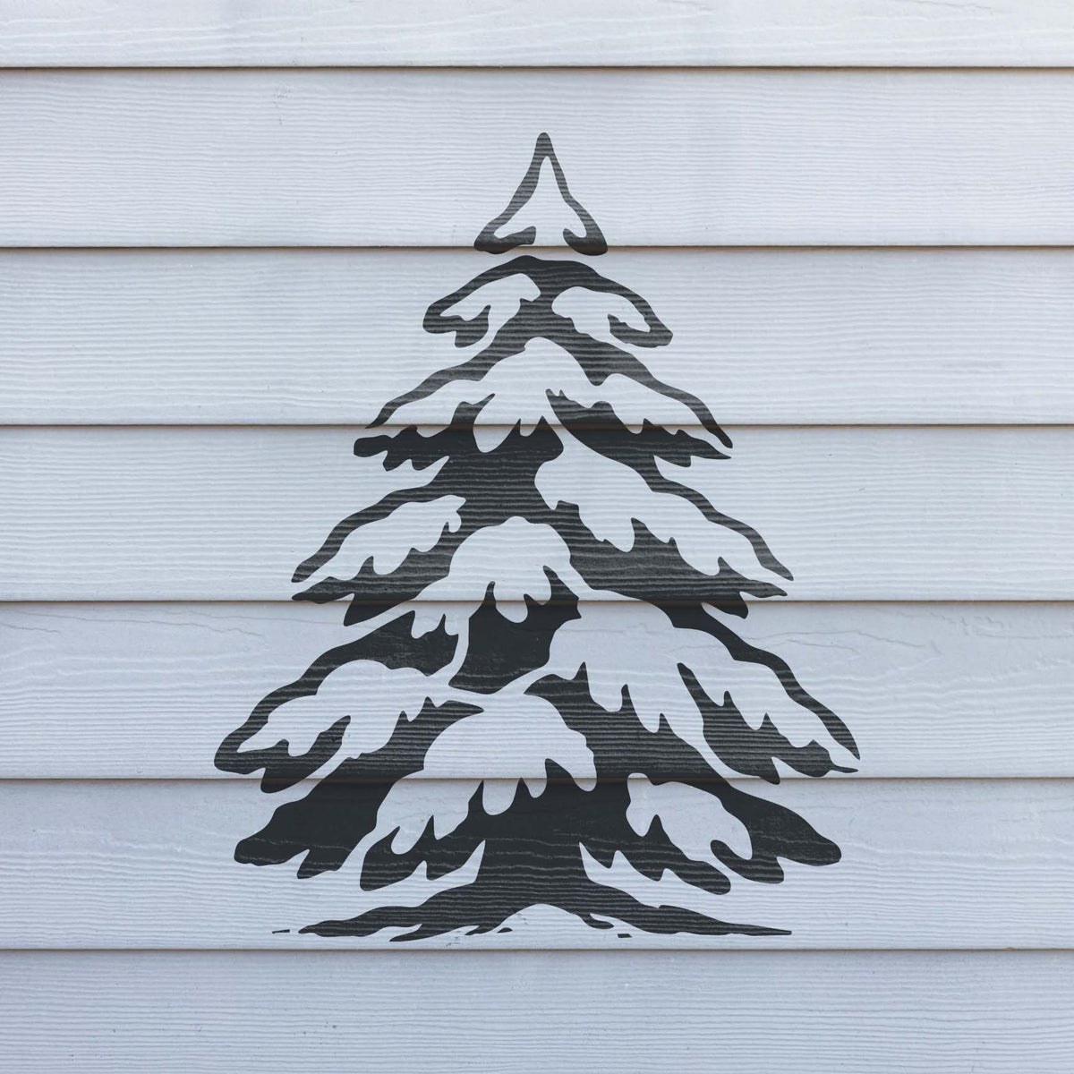 Rustic Snow Covered Pine Tree stencil displayed across white exterior siding