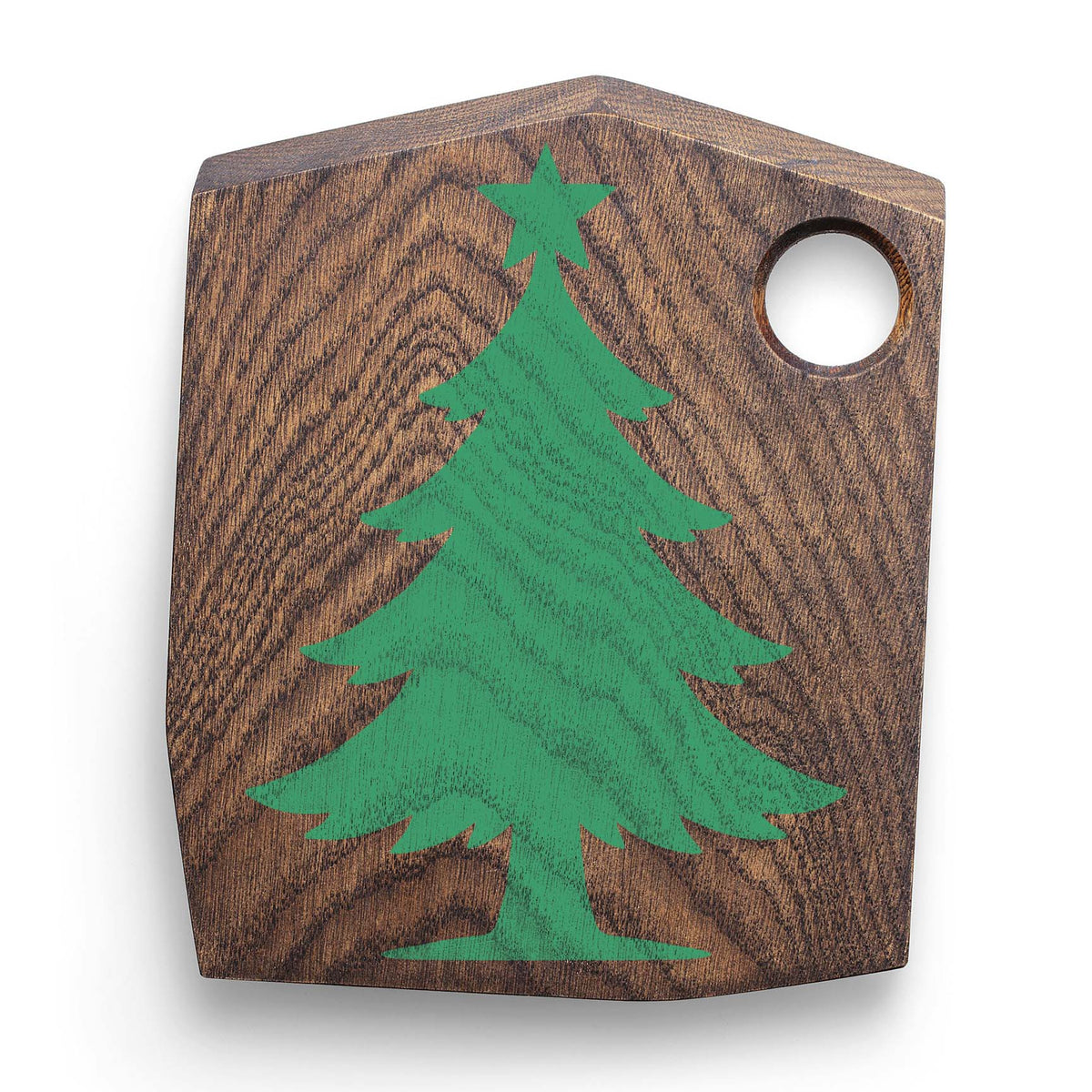 Rustic wood cutting board featuring the Star Topped Christmas Tree Stencil in green.