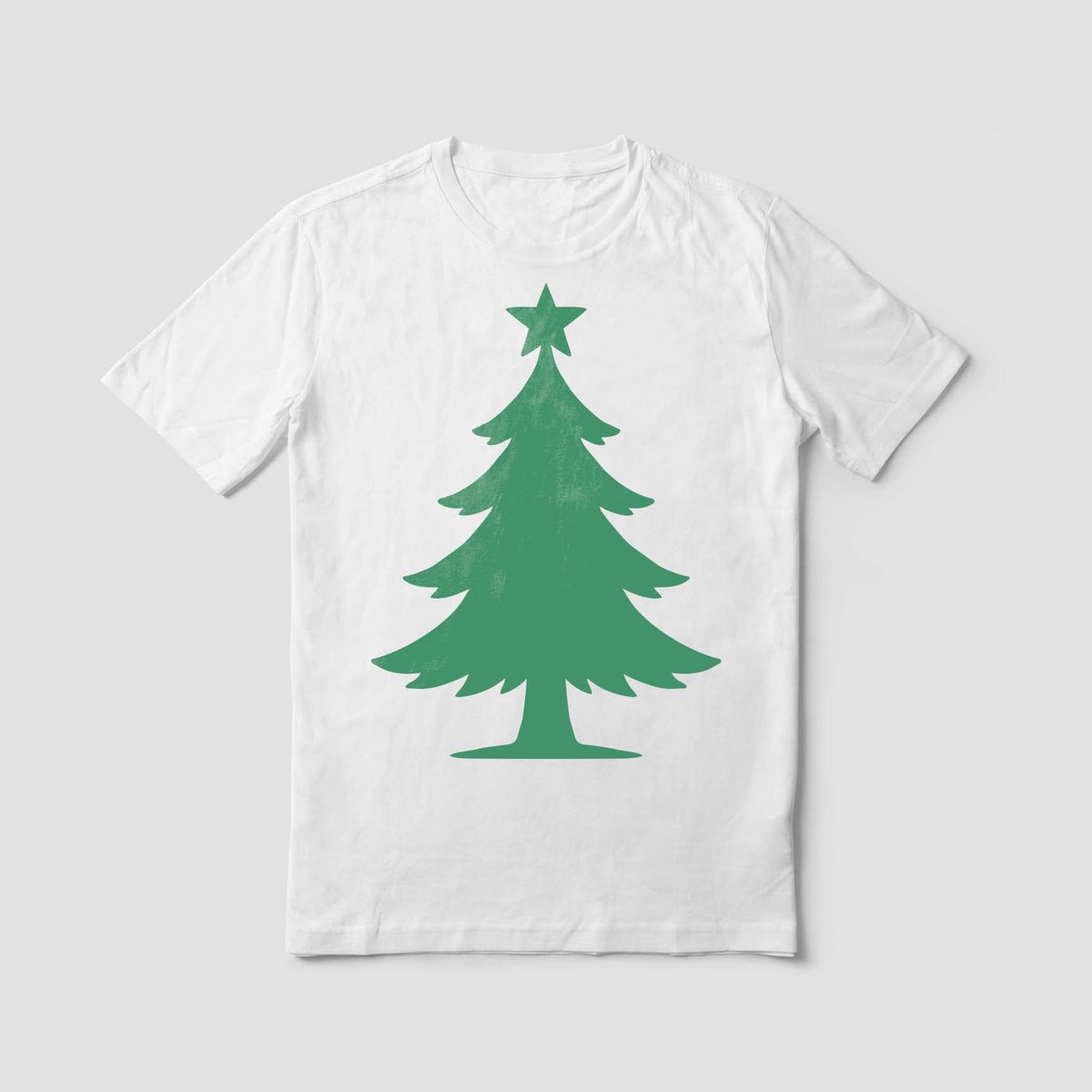 White t-shirt printed with the Star Topped Christmas Tree Stencil in soft green.