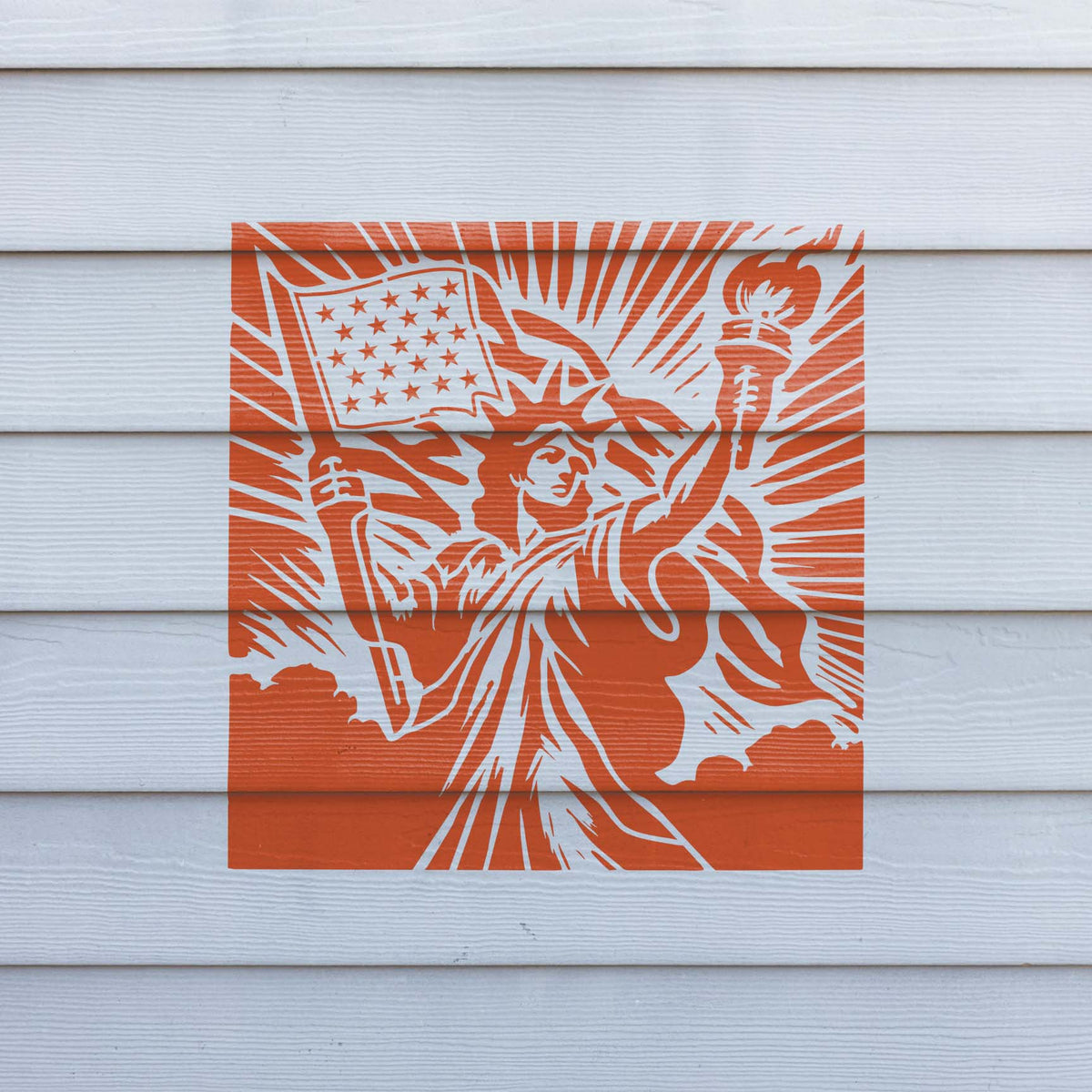 Orange wall art features the Statue of Liberty American Flag Stencil with torch and stars