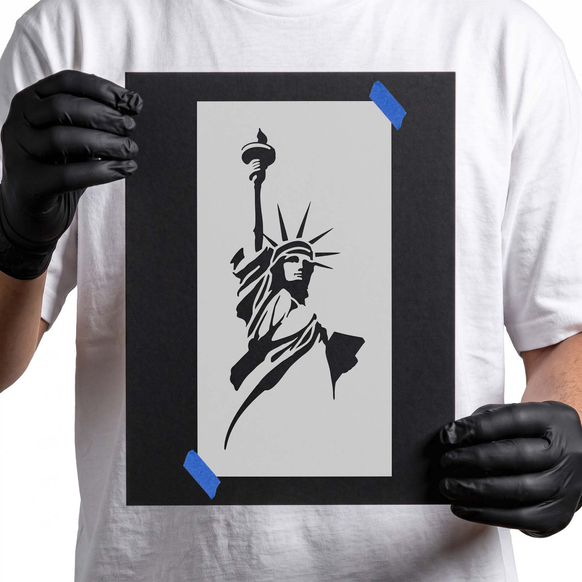 Statue of Liberty stencil with raised torch, crown, and flowing robes