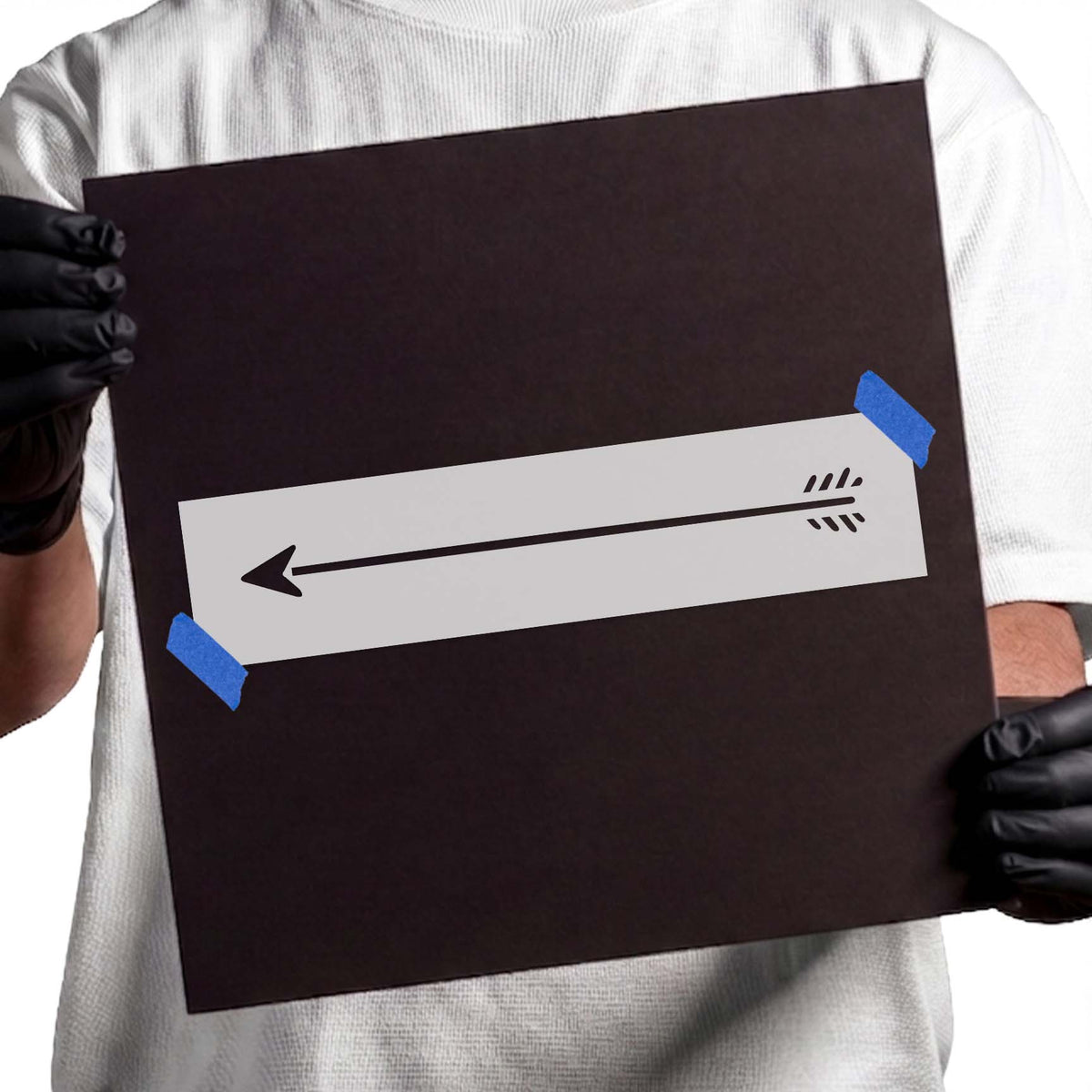 Left-pointing arrow stencil with a long shaft and feathered tail