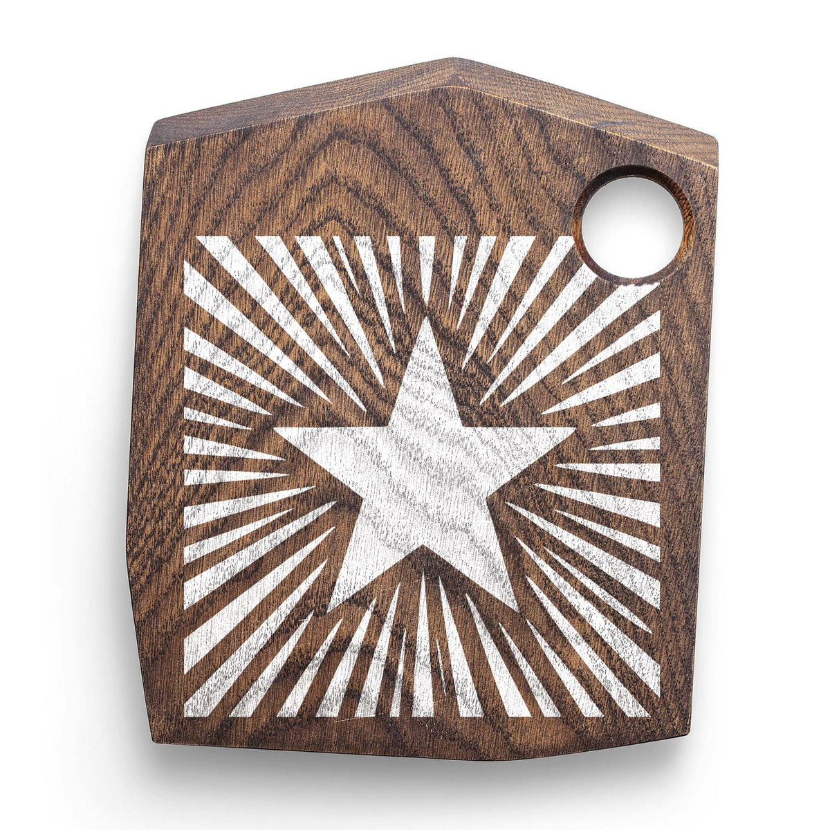 Rustic wood board features the Sunburst Star Stencil in white with bold radiating rays