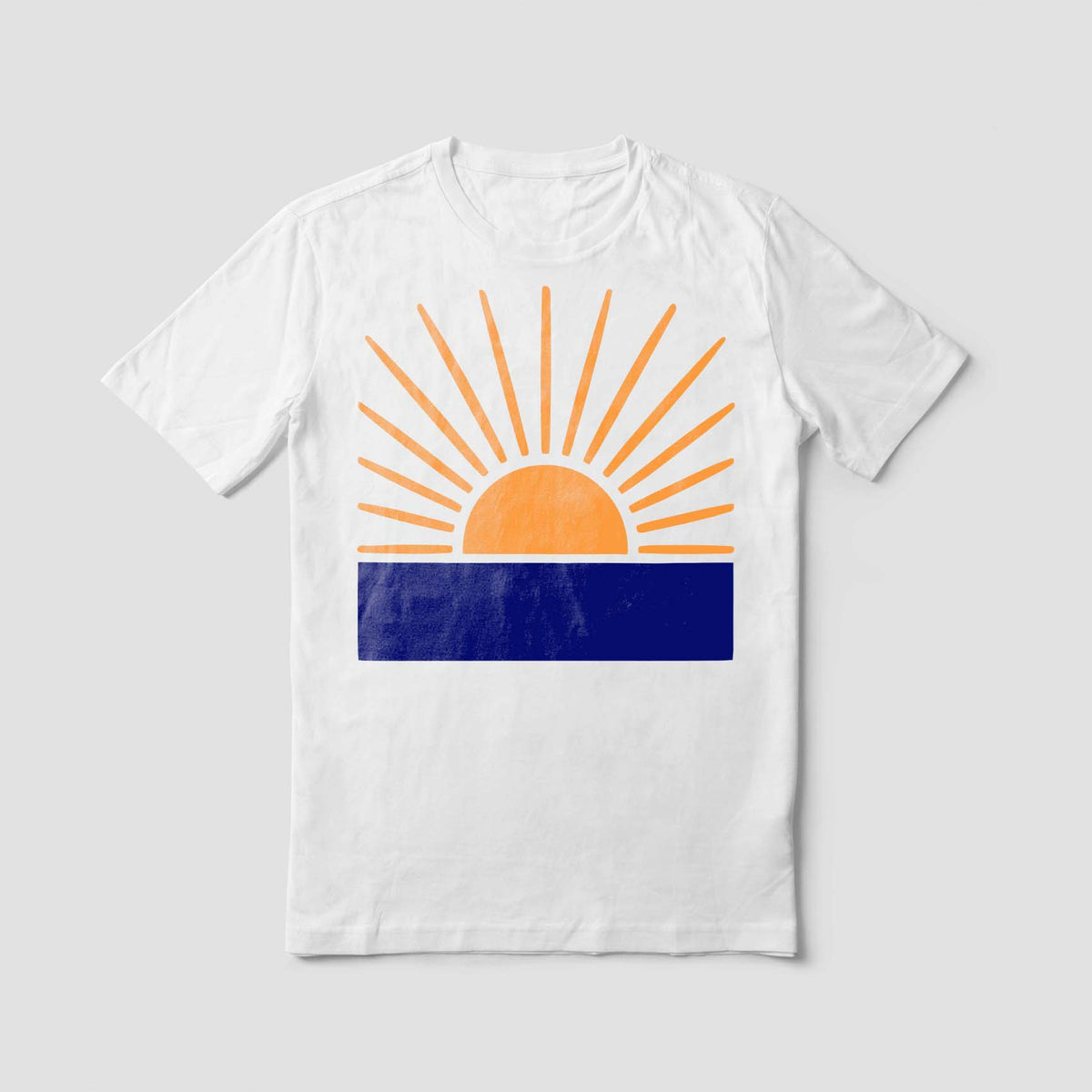 Orange Radiant Sunrise Horizon Stencil rises over a deep blue band on a crisp white T-shirt