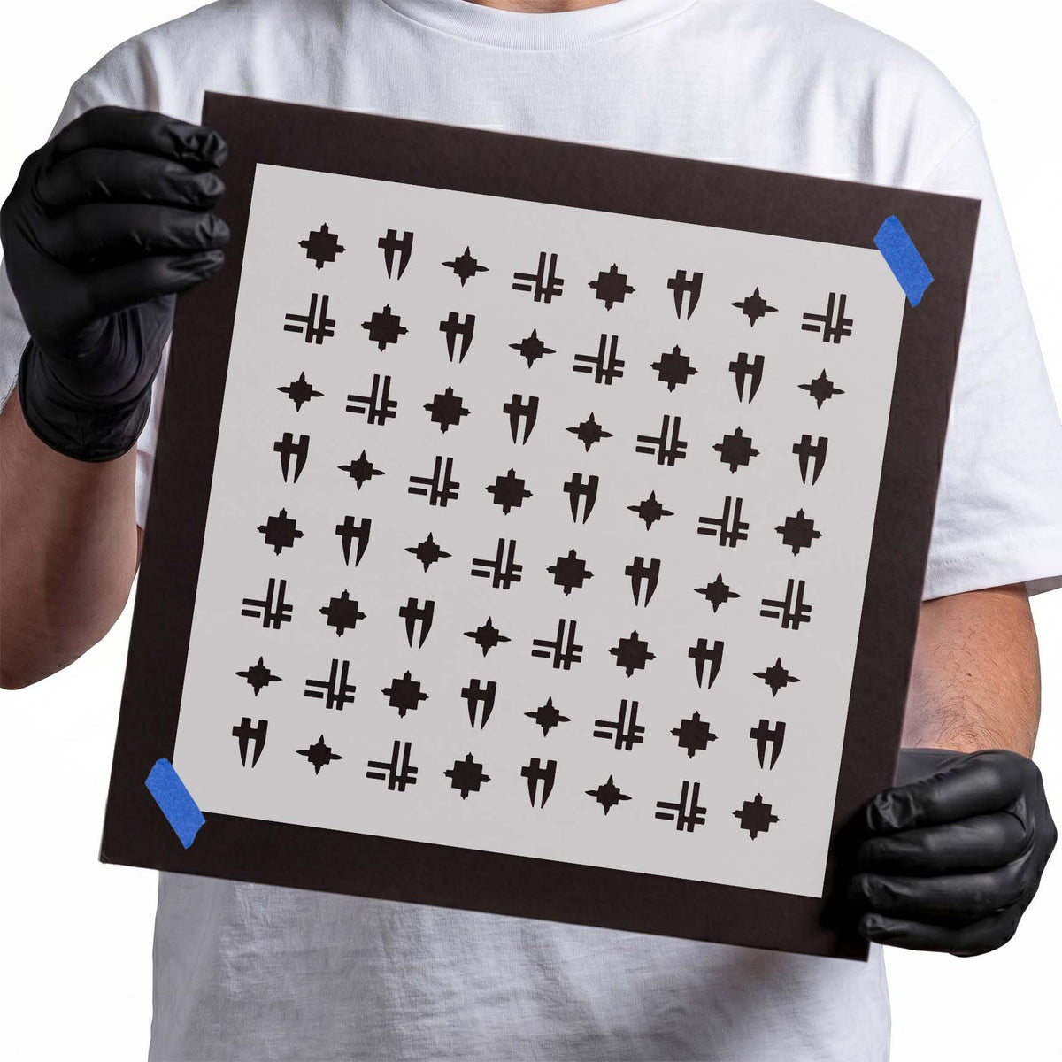 Symbols pattern stencil featuring repeating crosses, pointed starbursts, and angular geometric motifs