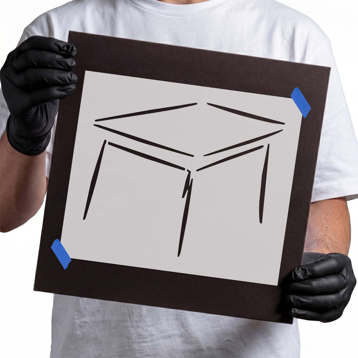 Table stencil featuring a rectangular tabletop in perspective with slender legs and angular lines