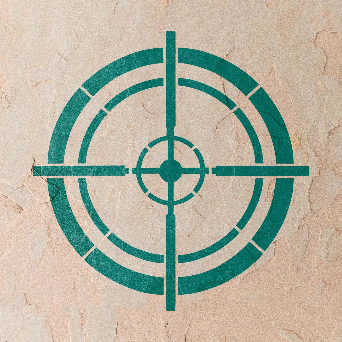 Crisp teal Tactical Crosshair Reticle Stencil appears across a weathered stucco wall
