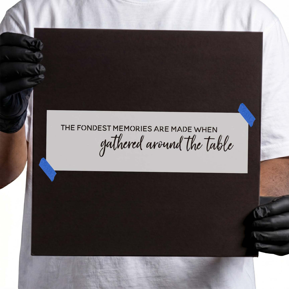 Family table quote stencil with uppercase text and flowing script lettering