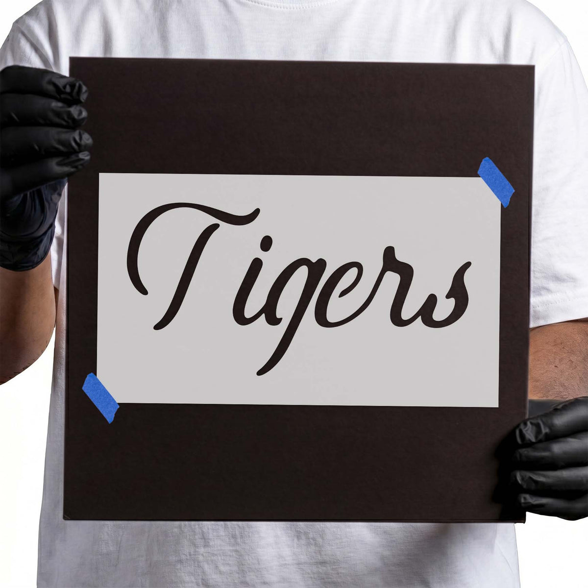 Tigers script stencil featuring bold flowing cursive lettering with decorative curved strokes