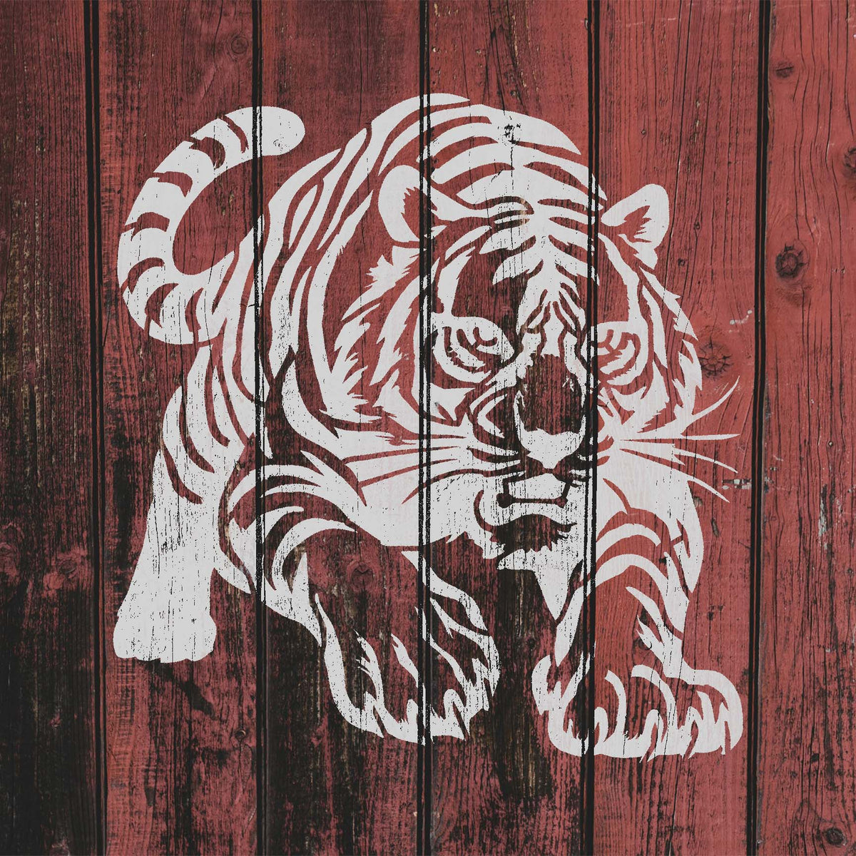 Striking Tiger on the Prowl Stencil charges forward across weathered red wood planks