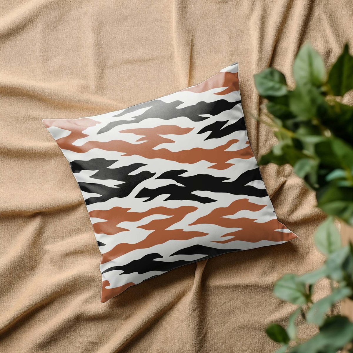 Layered Tiger Stripe Camouflage Pattern Stencil covers a pillow in earthy black and brown tones