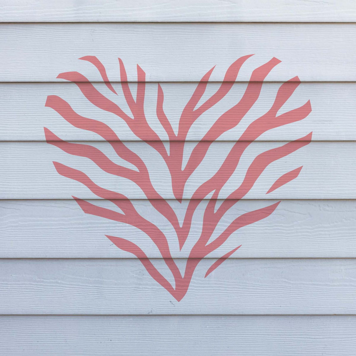 Flowing Tiger Stripe Heart Stencil forms a striking coral heart across white exterior siding