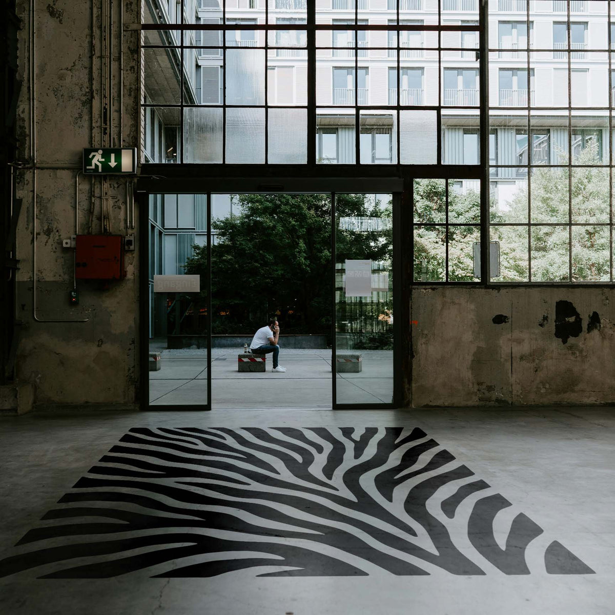 Bold Tiger Stripe Pattern Stencil stretches across a modern industrial concrete floor