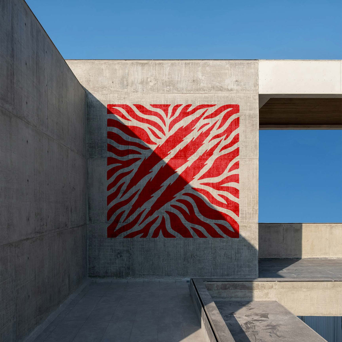 Red Tiger Stripes with Claw Marks Stencil creates a fierce graphic across a concrete wall