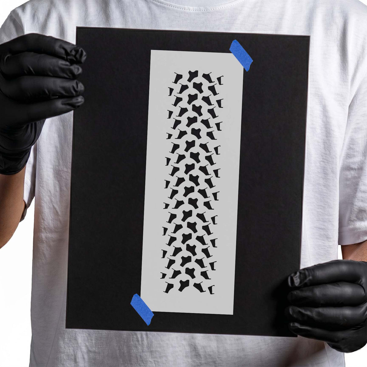 Tire Pattern Stencil featuring a vertical strip of repeating angular tread blocks and tire marks