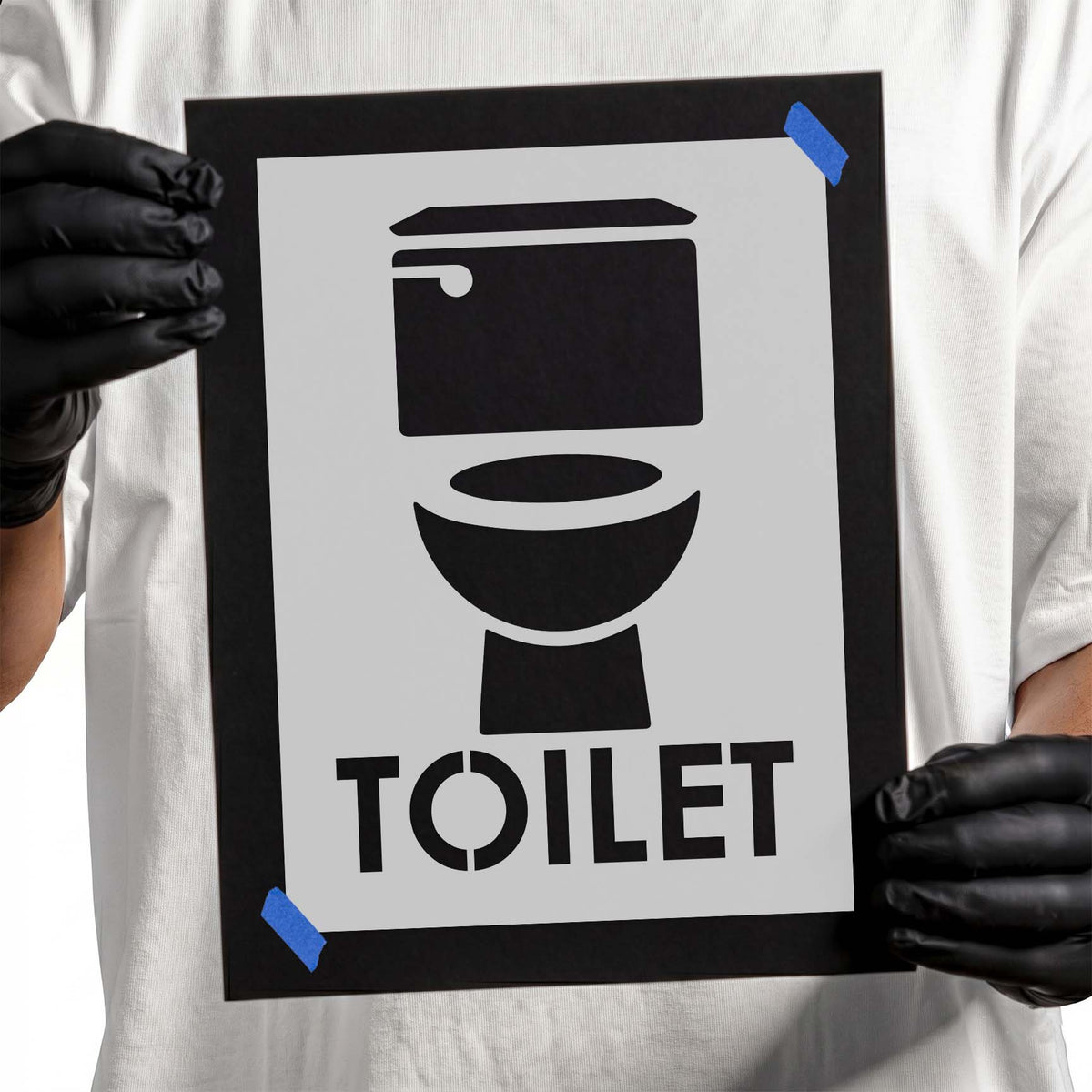 Toilet sign stencil with bold restroom icon and uppercase lettering
