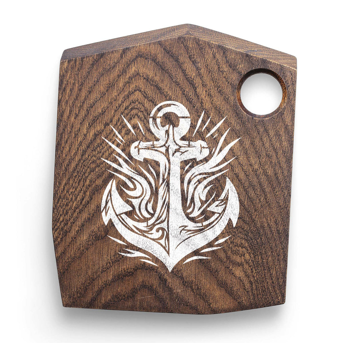 White Tribal Anchor Emblem Stencil stands out on a dark wooden cutting board
