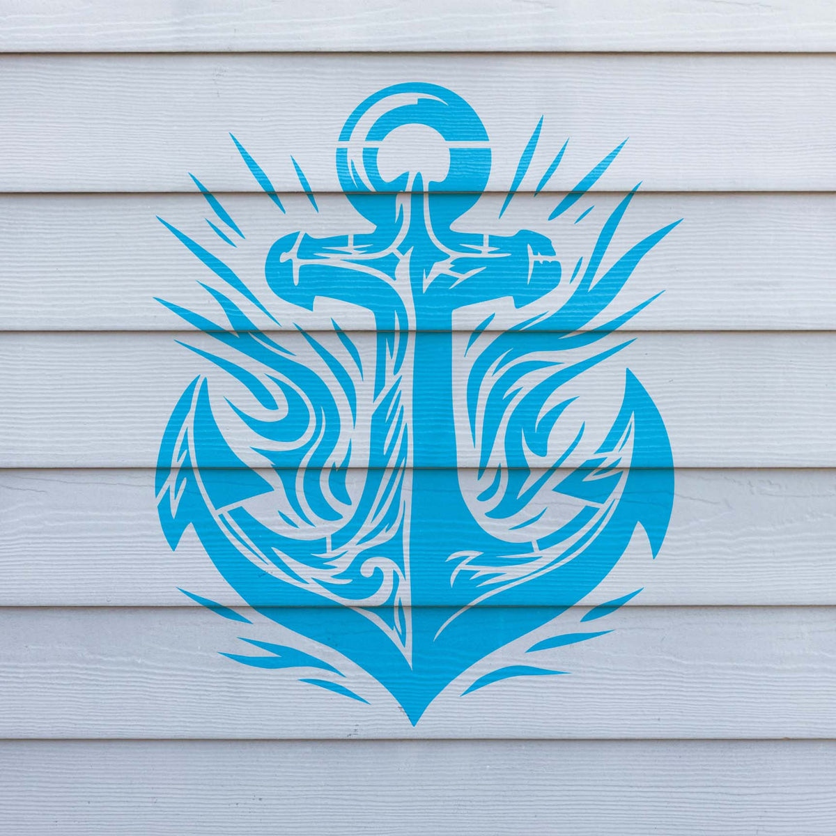 Nautical wall art from the Tribal Anchor Emblem Stencil in bright blue on white siding