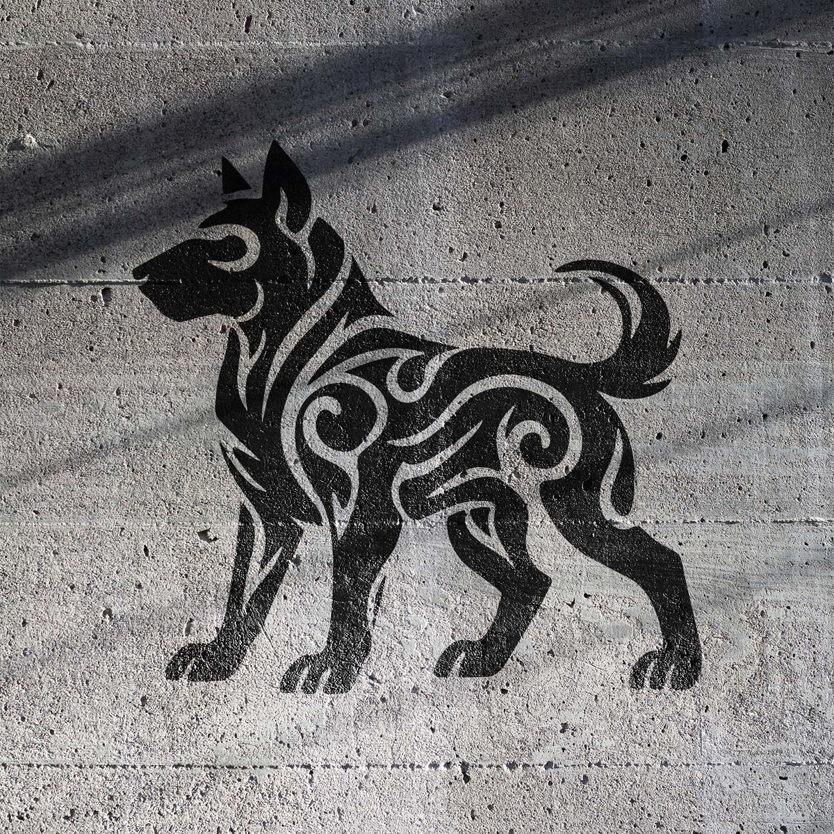 Tribal Dog Silhouette Stencil displays bold swirling canine details across a textured concrete wall