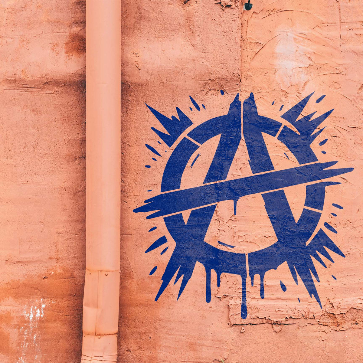 Electric blue Urban Anarchy Emblem Paint Splash Stencil adds rebellious graffiti flair to a peach stucco wall.