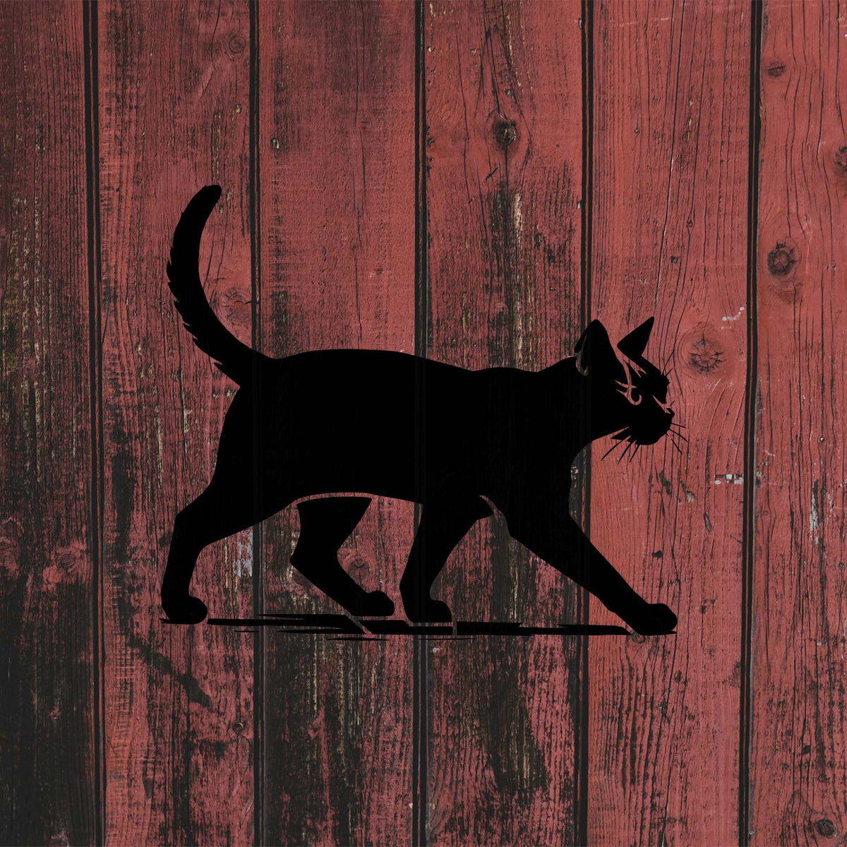 Walking Cat Silhouette Stencil stretches forward in black across weathered red wooden planks