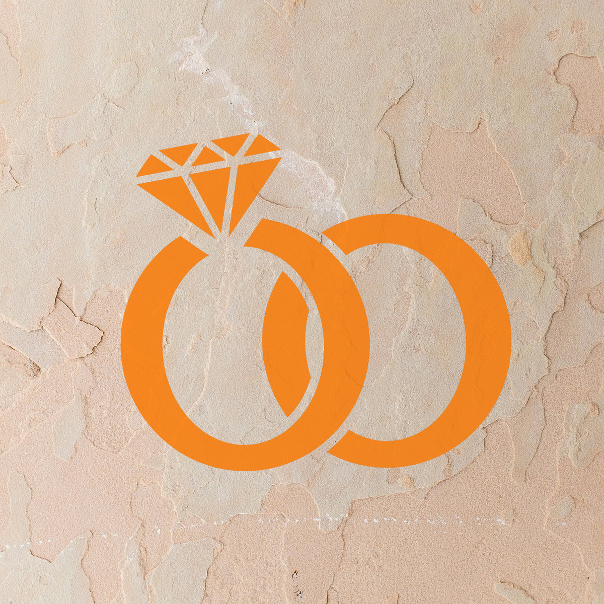 Interlocking Wedding Rings Stencil stands out in orange on stucco wall