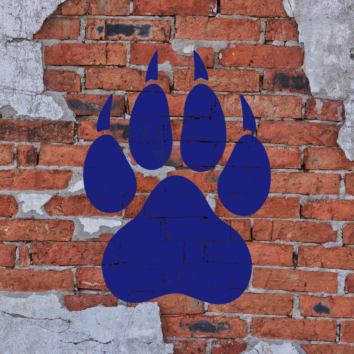 Bold blue Wolf Paw Print Stencil leaves a striking mark across a weathered exposed brick wall