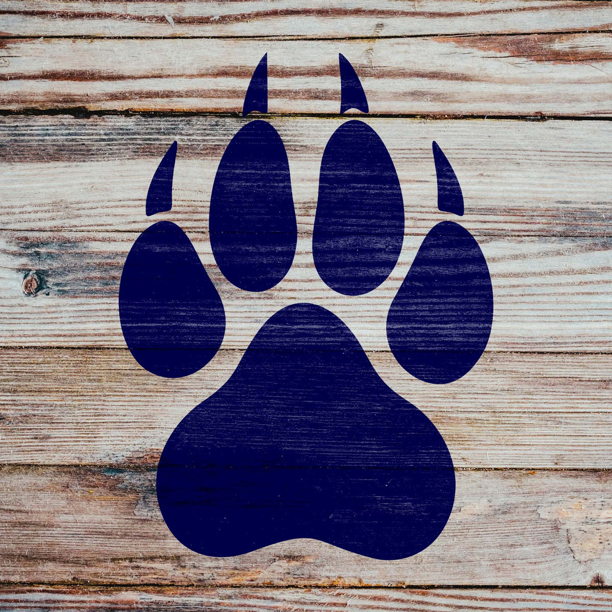 Deep blue Wolf Paw Print Stencil displays its clawed paw design on rustic weathered wood planks