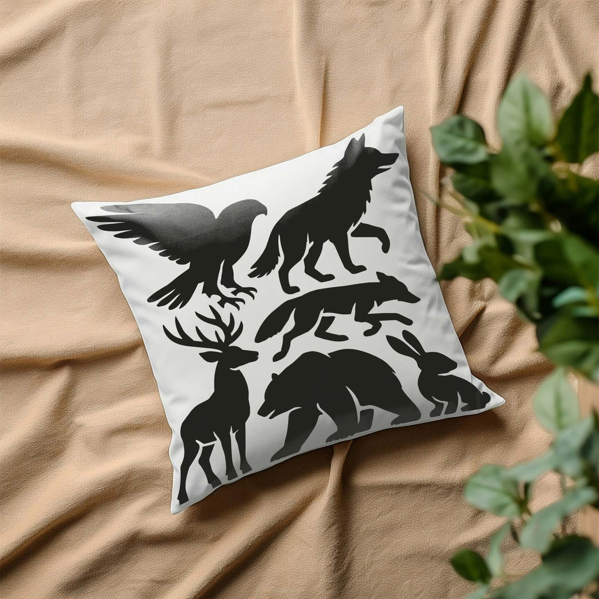 Woodland Animal Silhouette Stencil displays six forest creatures across a white pillow