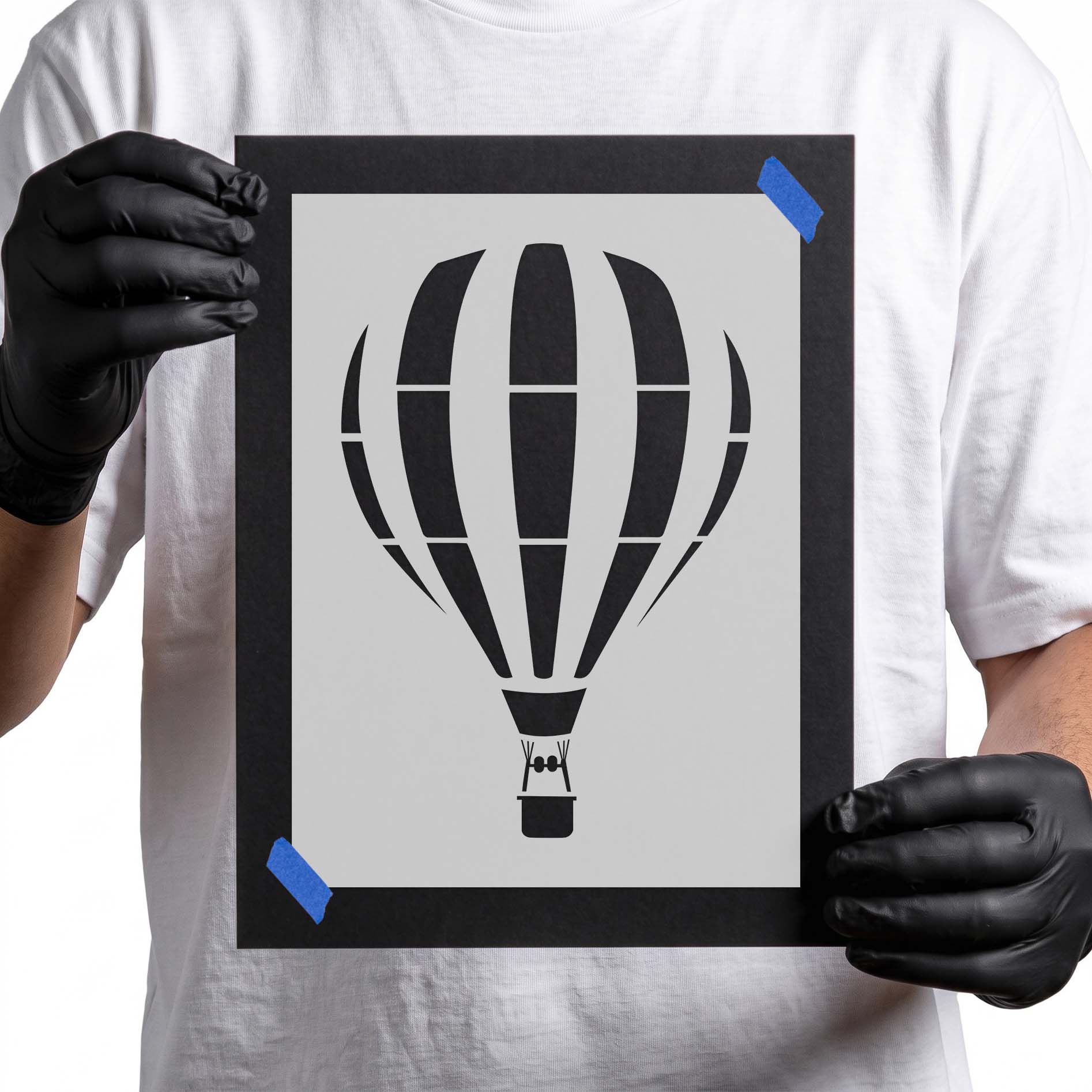 Striped hot air balloon stencil with suspended basket silhouette
