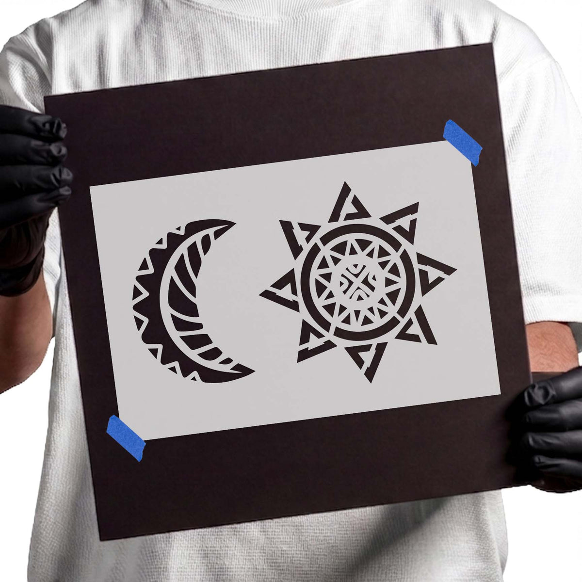 Celestial stencil with geometric crescent moon and ornate radiant sun