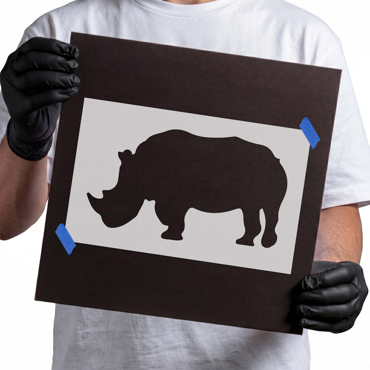 Rhinoceros stencil silhouette with prominent horn and broad body