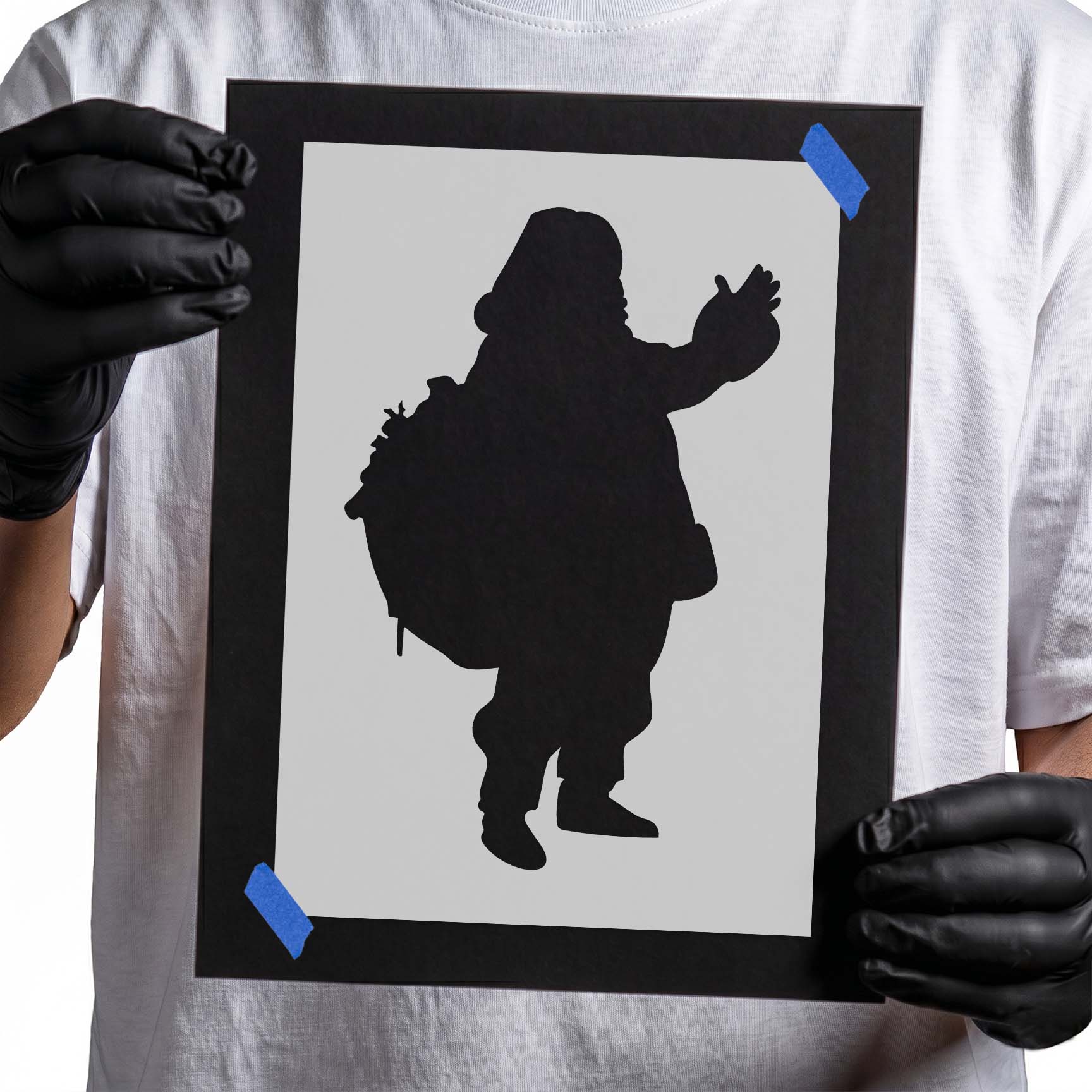 Santa Claus stencil waving while carrying a large gift sack