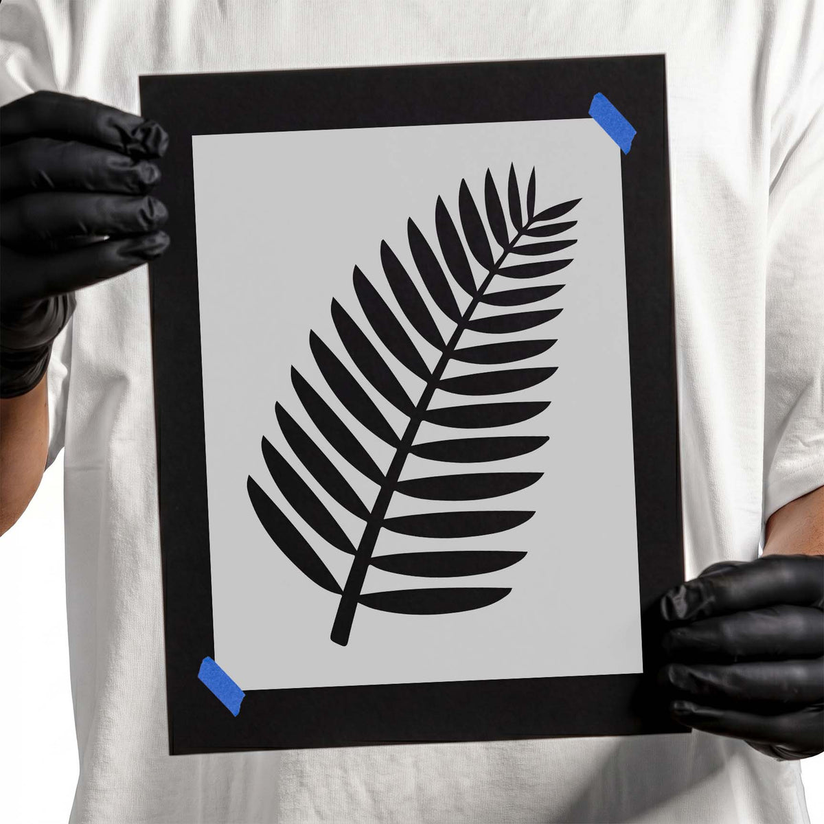 Tropical Leaf Stencil with a single curved palm-style frond and evenly spaced leaflets