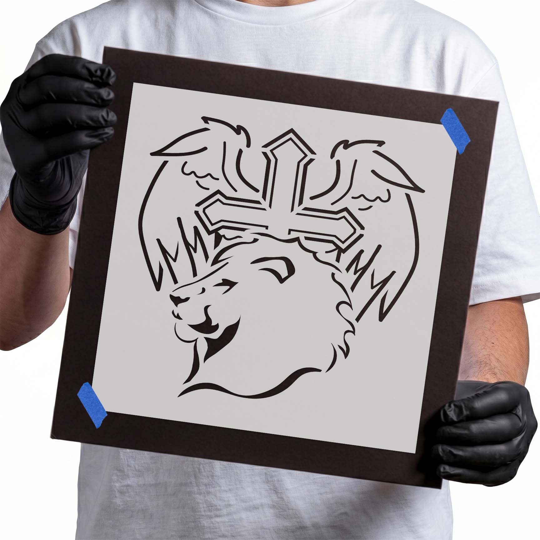 Lion stencil beneath a cross framed by sweeping angel wings