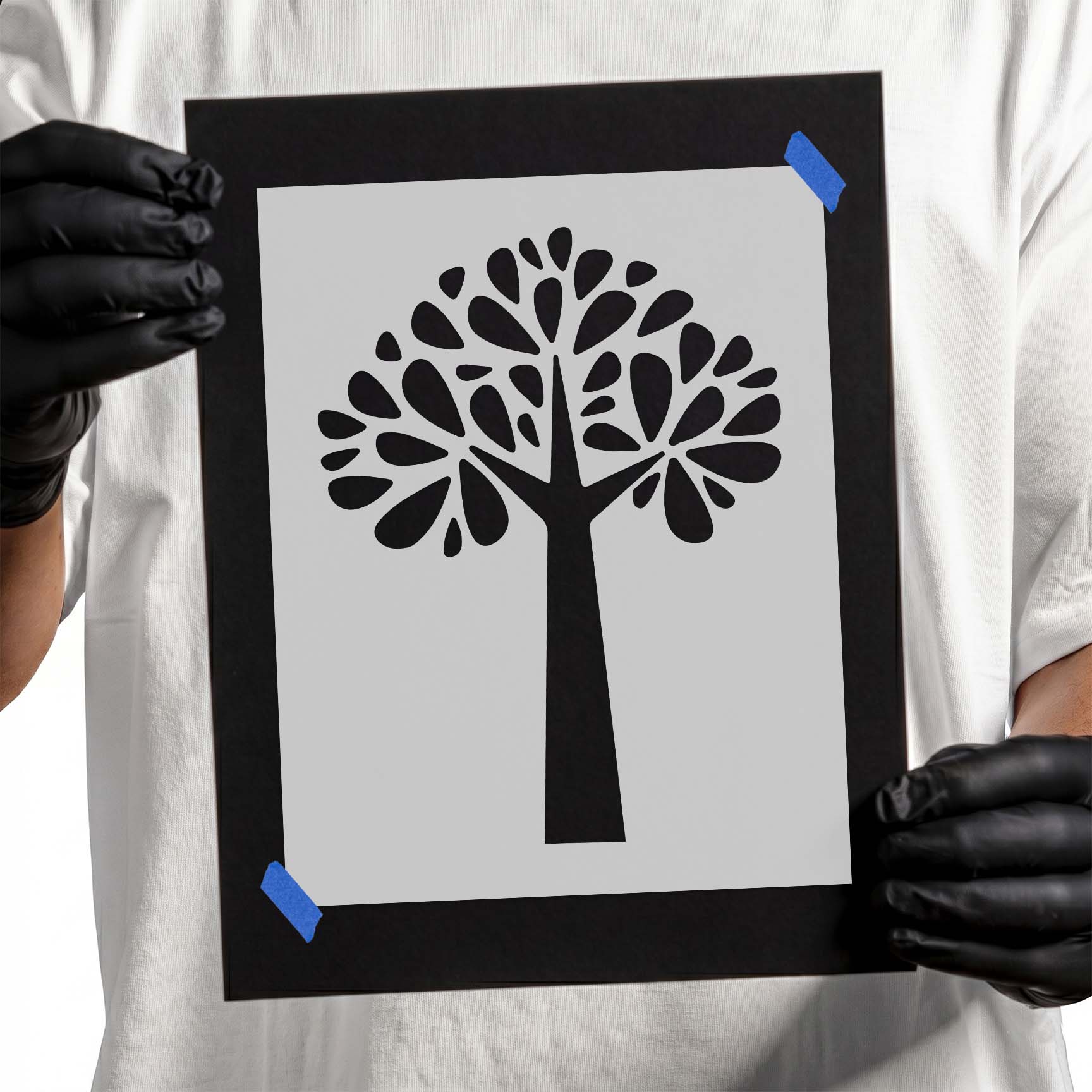 Stylized tree stencil with branching canopy and teardrop-shaped leaves