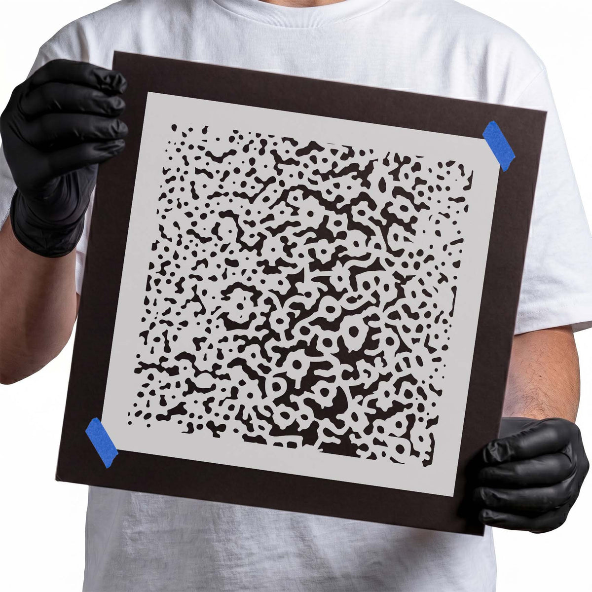 Stencil with asymmetrical dots, rings, squiggles, and organic abstract shapes