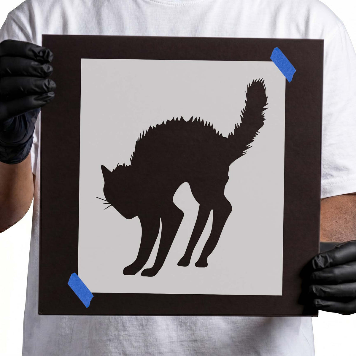 Black cat stencil with arched back, raised tail, and pointed ears