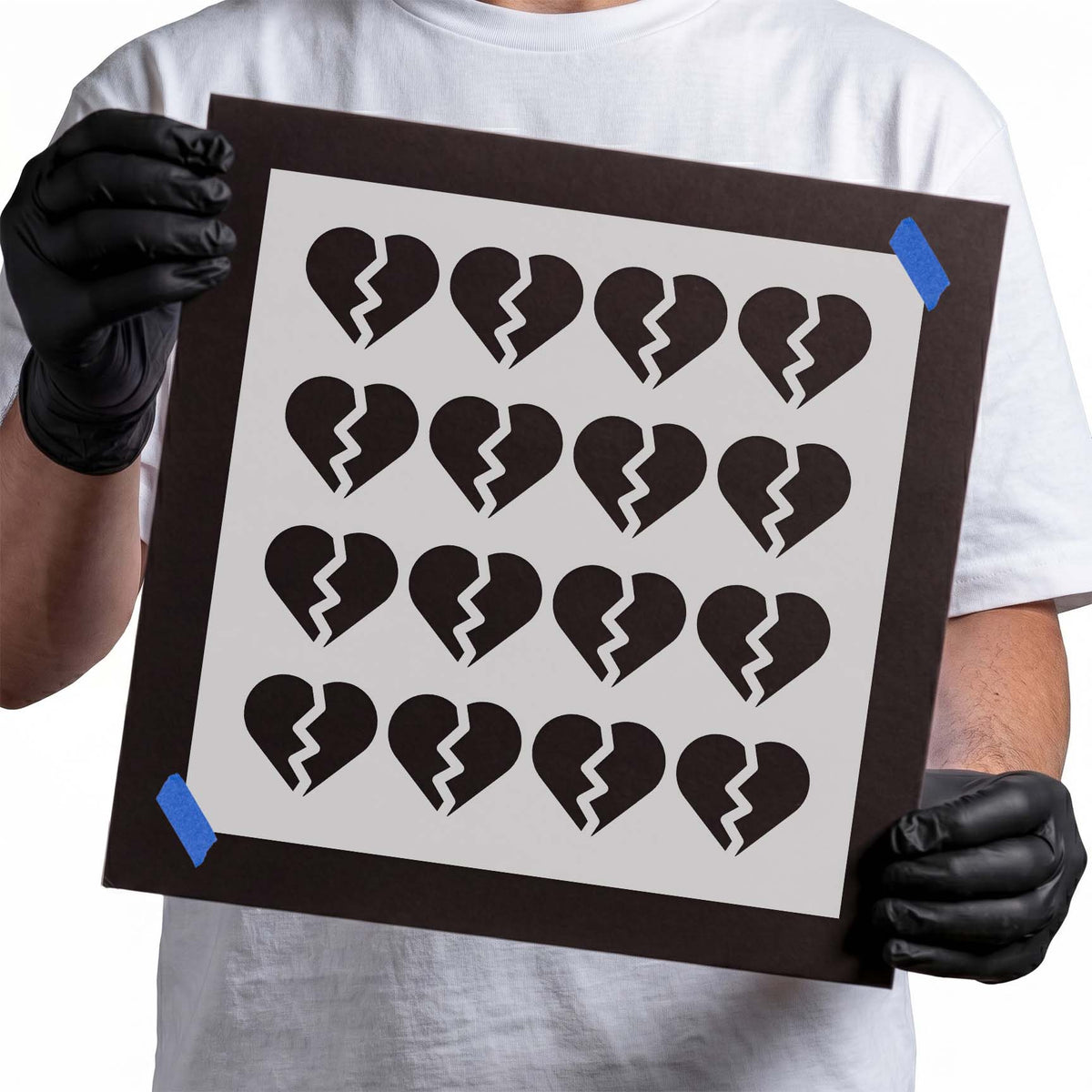 Repeating broken heart stencil pattern with jagged center cracks
