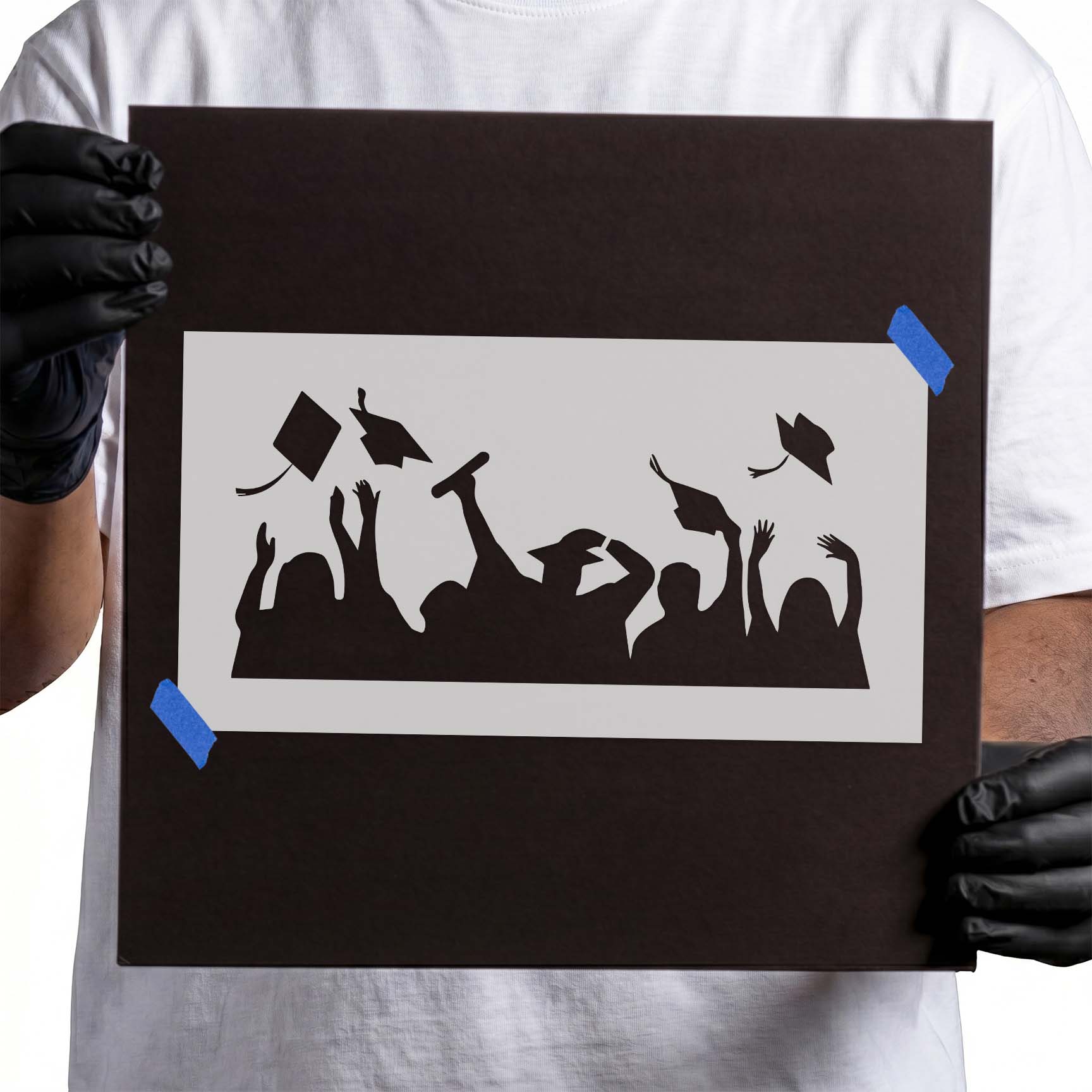 Graduation stencil with cheering graduate silhouettes and flying caps
