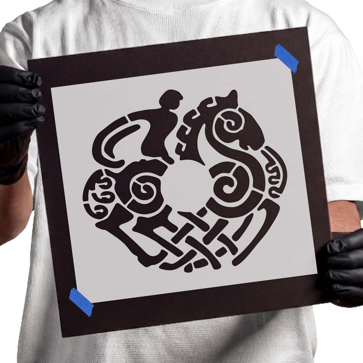 Celtic horseman stencil surrounded by spirals and ornamental shapes