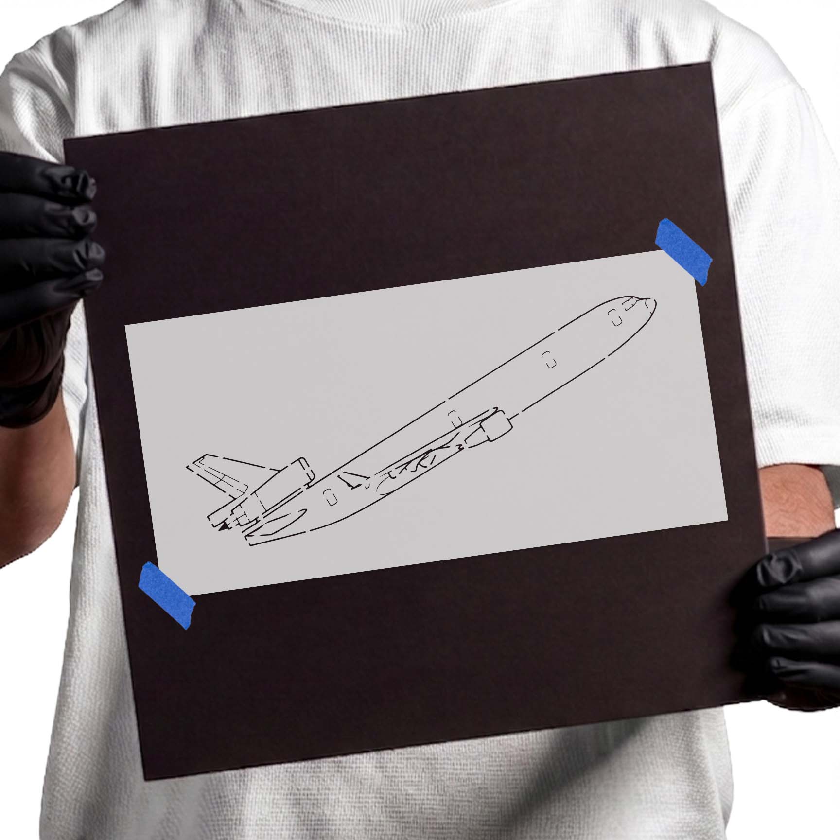 Commercial airplane stencil showing a passenger jet climbing at an angle